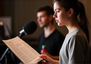 Young singer practicing a song intensely for an audition